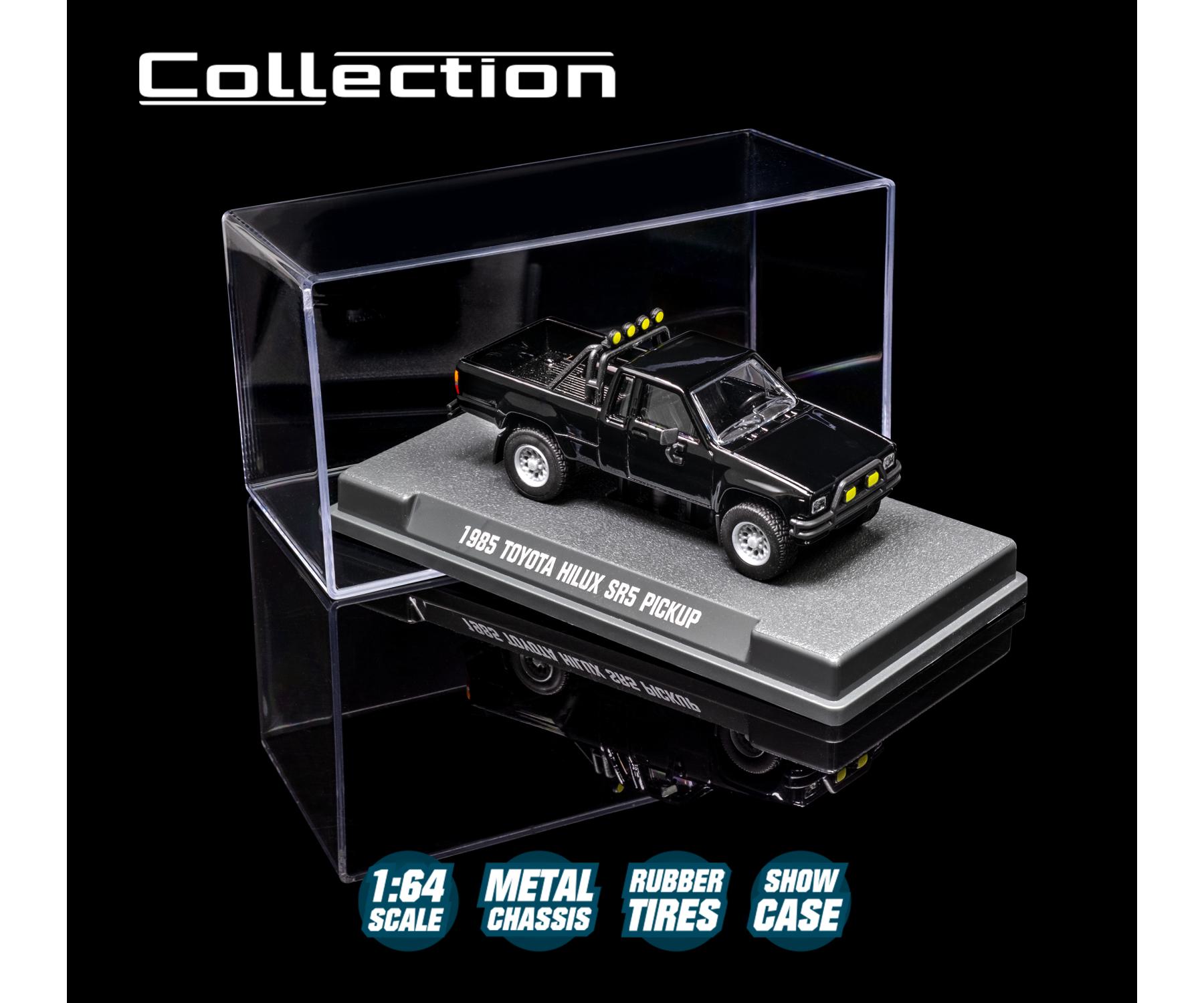 1985 Toyota Hilux SR5 Pickup Black 1:64 Scale Model Car – Majorette Premium (Product Code: 8505001016) in a clear display case with branding and product details.