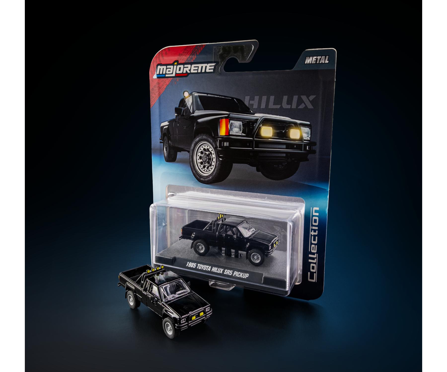 card art with acrylic case 1985 Toyota Hilux SR5 Pickup Black 1:64 Scale Model Car – Majorette Premium (Product Code: 8505001016)