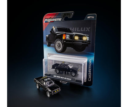 card art with acrylic case 1985 Toyota Hilux SR5 Pickup Black 1:64 Scale Model Car – Majorette Premium (Product Code: 8505001016)