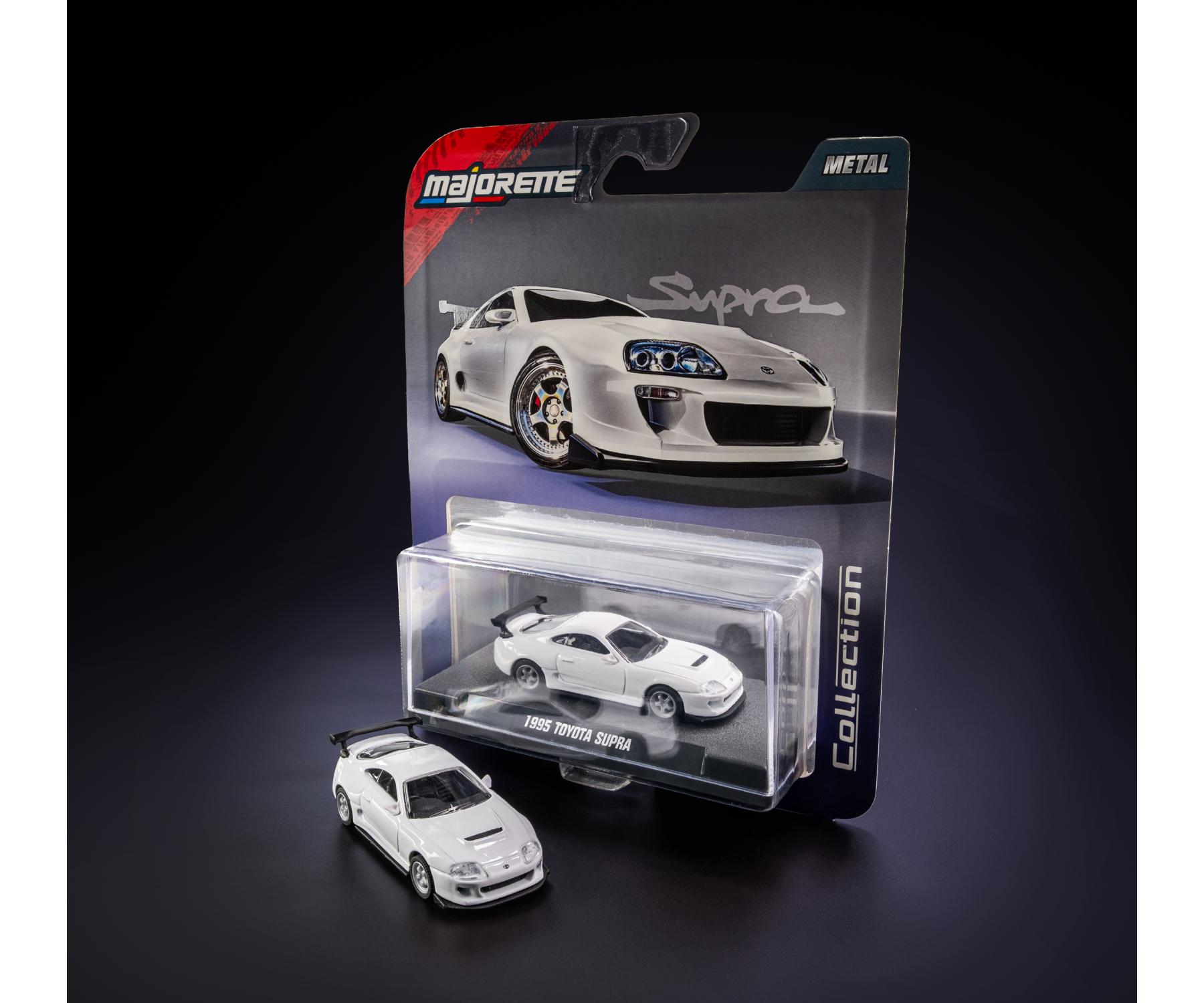 1995 Toyota Supra White 1:64 Scale Model Car – Majorette Premium (Product Code: 8505001017) in packaging with 'Majorette' branding on a dark background