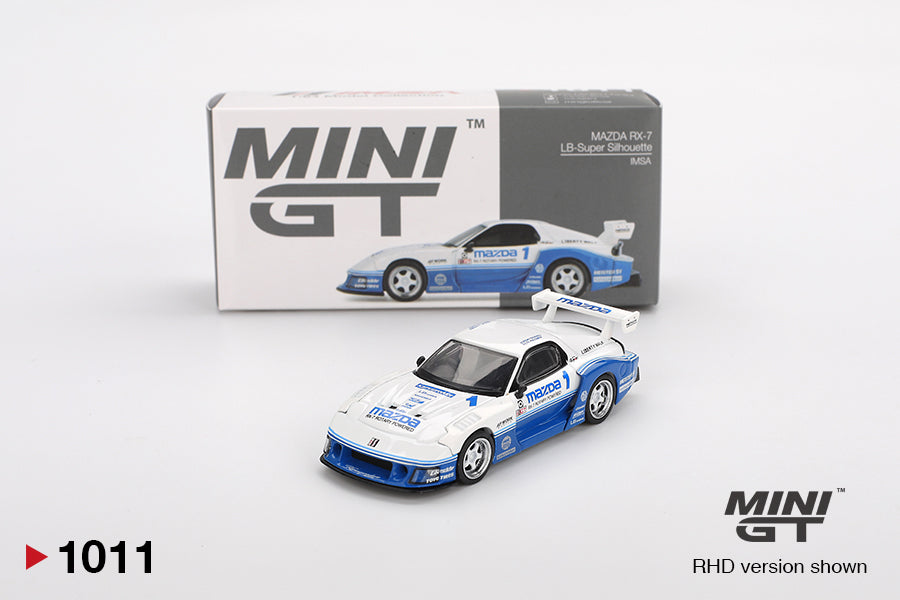 Miniature model car of a Mazda RX-7 with packaging on a white background, featuring the MINI GT brand.