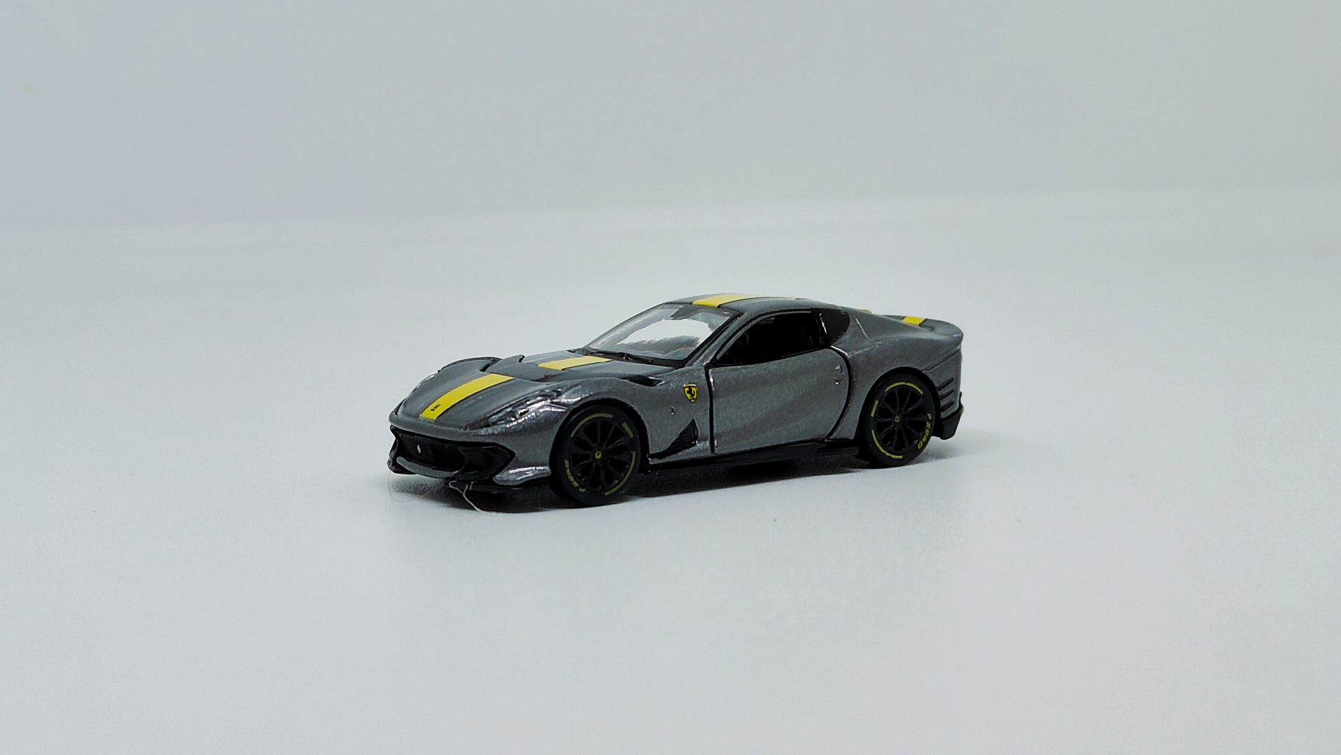 Front perspective view Ferrari 812 Competizione Grey 1:64 scale model car - Bburago