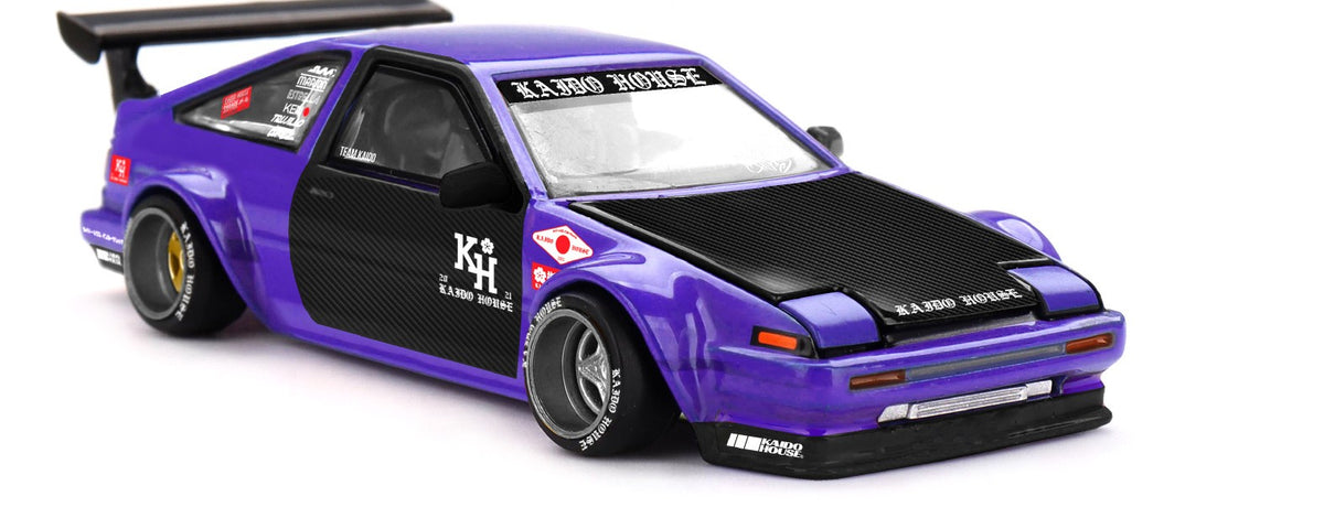 Kaido House x Mini GT Toyota AE86 Sprinter Trueno Kaido Touge V1 purple and black 1:64 scale diecast model car, front three-quarter view showing the black carbon-look hood and front splitter