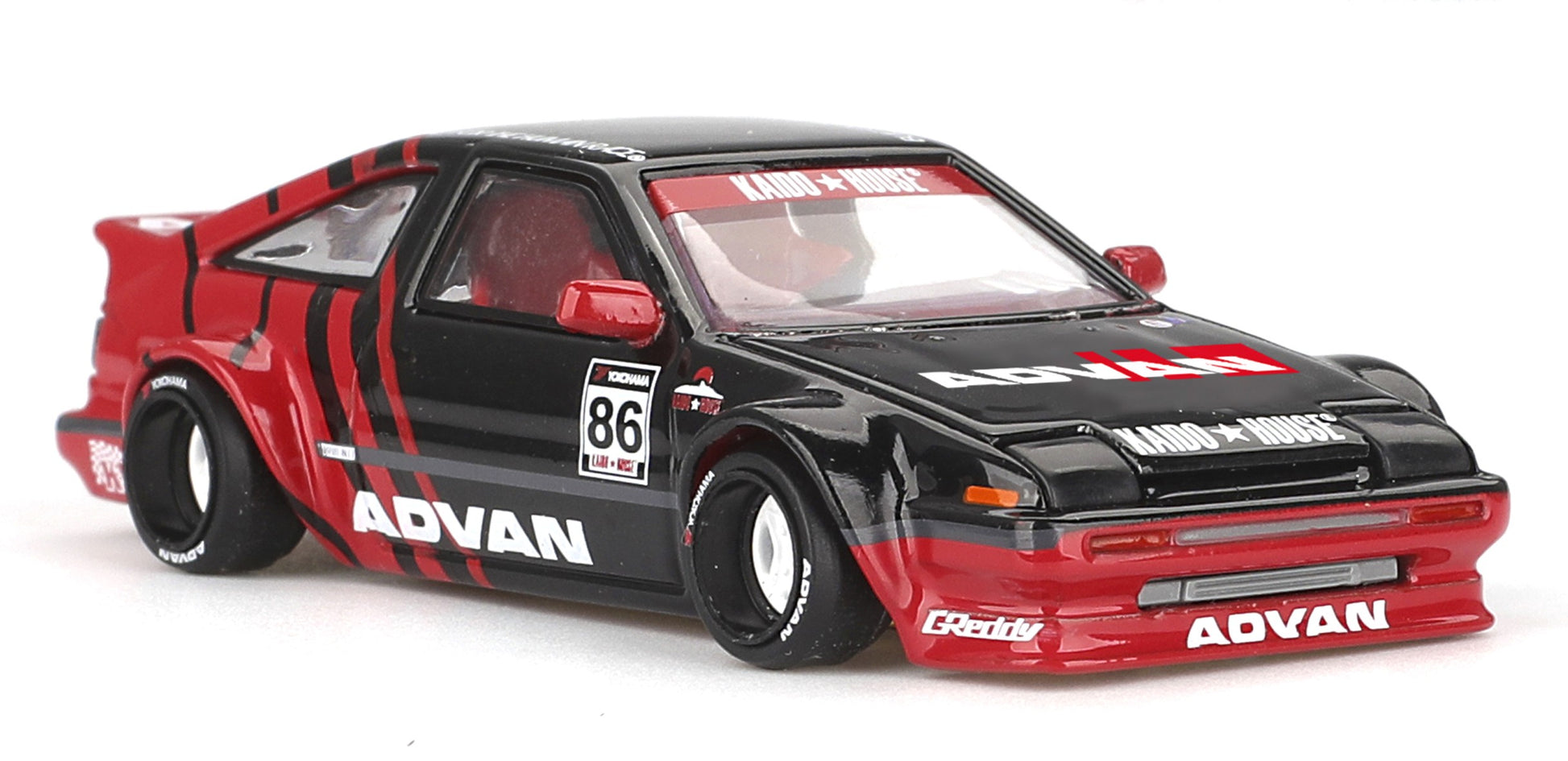 Front view of Toyota AE86 Sprinter Trueno Kaido ADVAN red and black 1:64 diecast model car by Kaido House x Mini GT (KHMG0214)