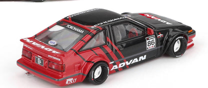 Side profile of Toyota AE86 Sprinter Trueno Kaido ADVAN 1:64 scale model car showing the race number 86 and over-fenders (KHMG0214)