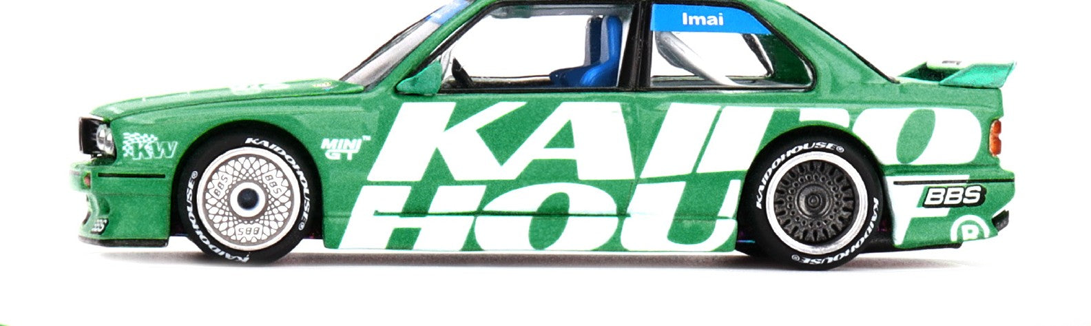 Side profile of BMW M3 E30 Kaido Works V2 green 1:64 scale model car with BBS-style wheels (KHMG0242)