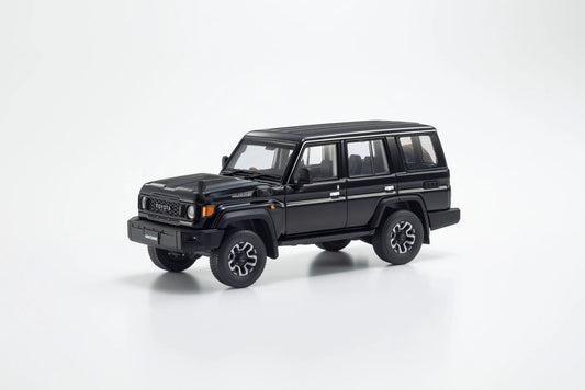 Front three-quarter view of Toyota Land Cruiser 70 Attitude Black Mica 1:43 diecast model car by Kyosho showing the blacked-out TOYOTA grille (03928BK)