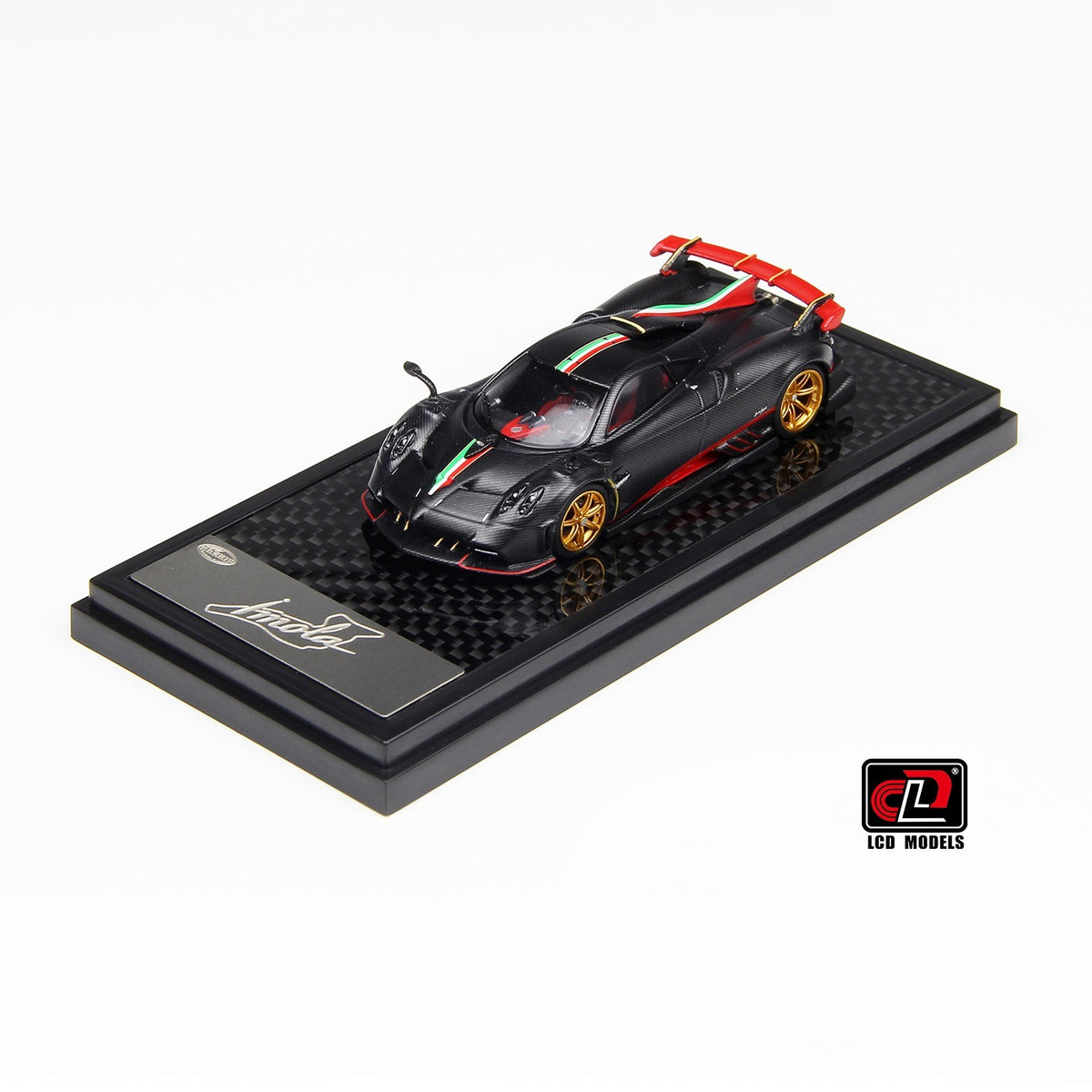 Front three-quarter view of Pagani Imola matte black carbon 1:64 diecast model car by LCD Models with Italian tricolore stripes and gold wheels (LCD64041-MBCI)