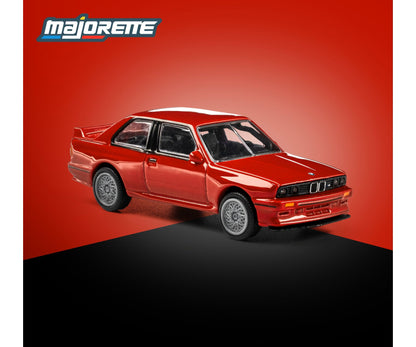 majorette collection 1986 bmw m3 red 1:64 scale diecast model car front three-quarter view, showing the boxed arches and quad headlamps