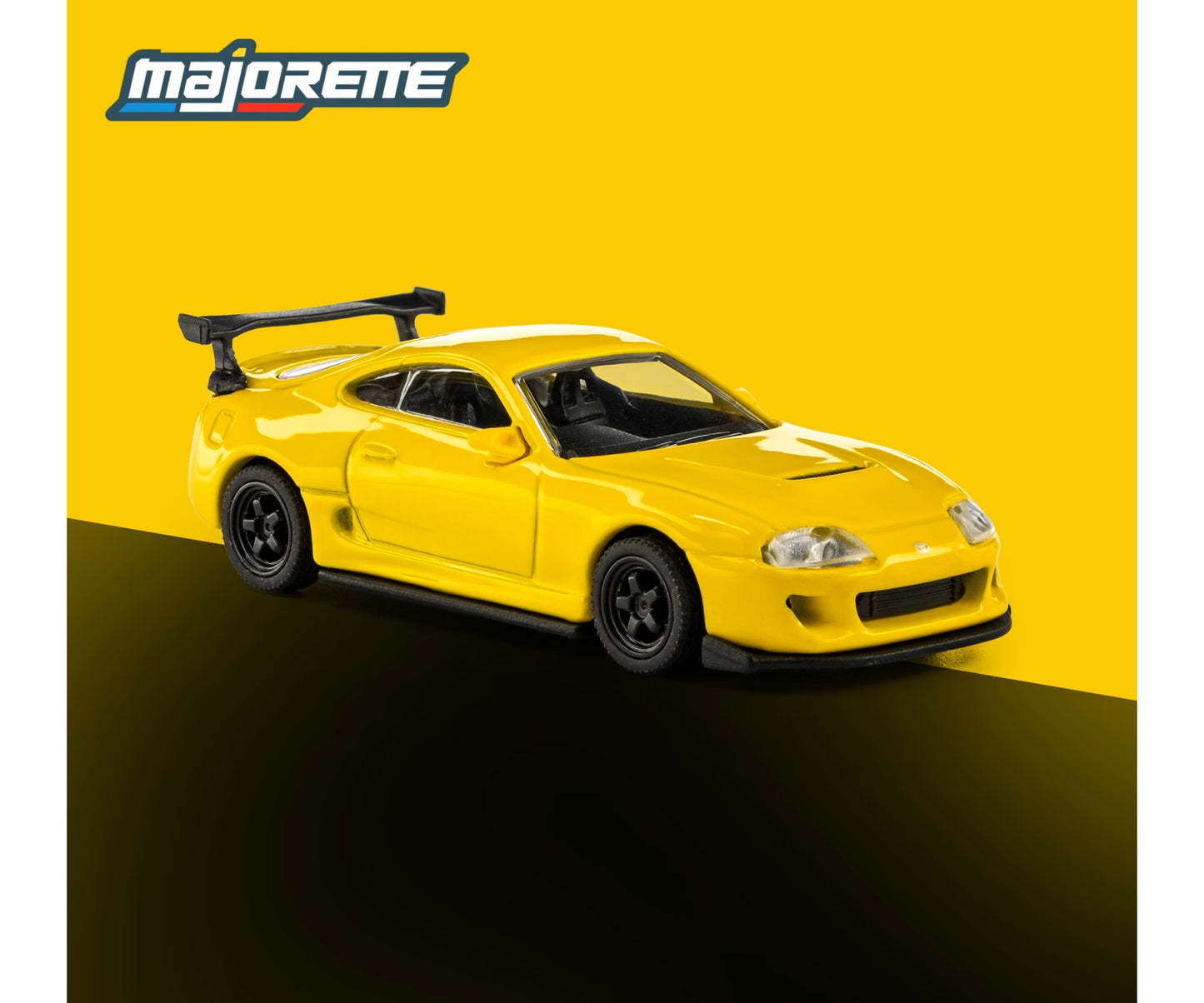 majorette collection 1995 toyota supra yellow 1:64 scale diecast model car front three-quarter view, showing the vented bonnet and tall rear wing