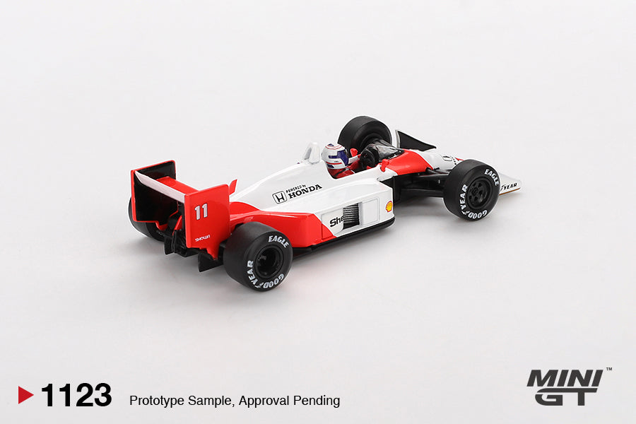 Front three-quarter view of McLaren MP4/4 #11 Alain Prost 1:64 diecast showing the front wing and red and white McLaren-Honda livery (MGT01123)