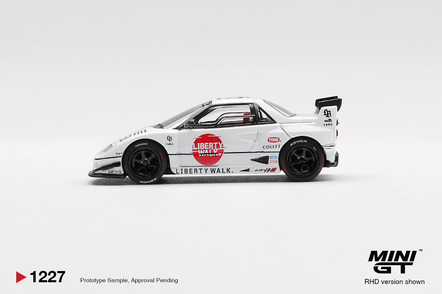 Side profile of Mazda AZ-1 Liberty Walk LB40 LB-Hinomaru 1:64 scale model car with red Hinomaru roundel and black ADVAN wheels (MGT01227)