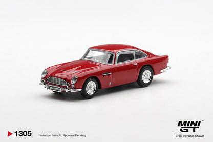 Mini GT Aston Martin DB5 Fiesta Red 1:64 scale diecast model car, front three-quarter view showing the Aston Martin grille and chrome bumper