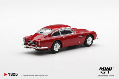 Mini GT Aston Martin DB5 Fiesta Red 1:64 scale diecast model car, rear three-quarter view showing the chrome rear bumper and tail lights