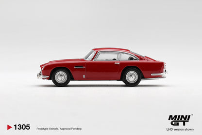 Mini GT Aston Martin DB5 Fiesta Red 1:64 scale diecast model car, side profile showing the fastback roofline and wire-spoke wheels