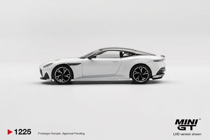 Side profile of Aston Martin DBS Stratus White 1:64 scale model car showing the long bonnet and dark multi-spoke wheels (MGT01225)