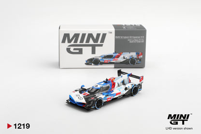 Mini GT BMW M Hybrid V8 Hypercar #15 BMW M Team WRT 2024 Le Mans 24 Hrs 1:64 scale diecast model car shown with its Mini GT collector box