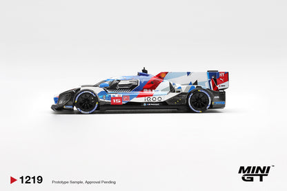 Mini GT BMW M Hybrid V8 Hypercar #15 white and blue 1:64 scale diecast model car, side profile showing the #15 number board and geometric BMW M livery