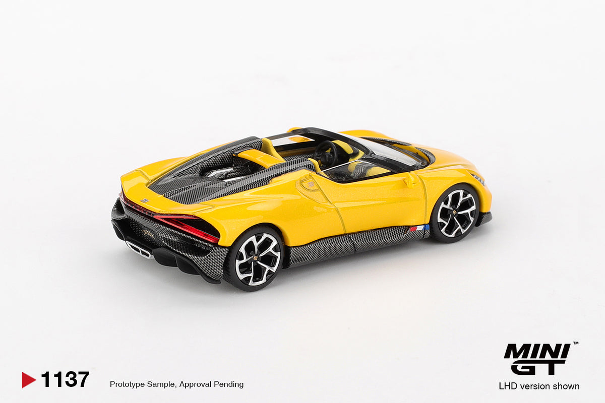 Mini GT Bugatti W16 Mistral yellow 1:64 scale diecast model car, rear three-quarter view showing the X-motif LED tail light bar and roof air scoops