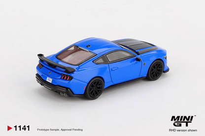 Mini GT Ford Mustang Dark Horse 2024 Grabber Blue 1:64 scale diecast model car, rear three-quarter view showing the black rear wing and smoked tail lamps
