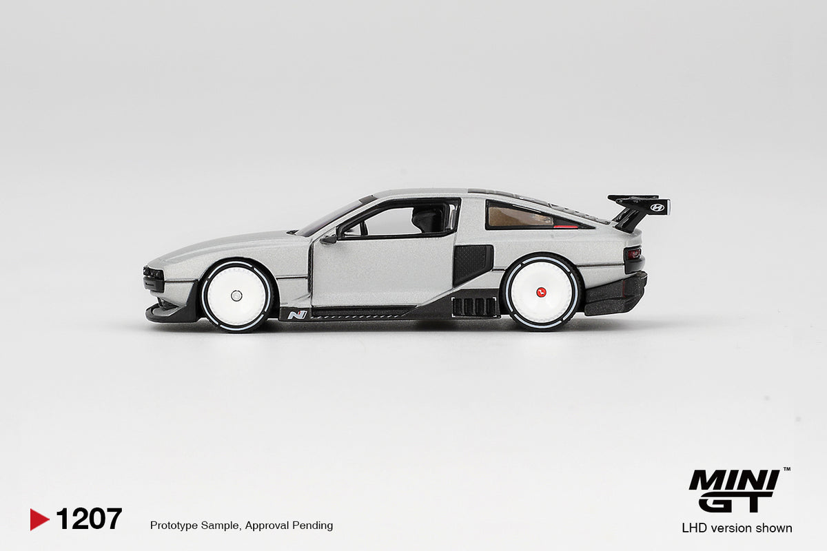 Mini GT Hyundai Concept N Vision 74 (VP2) silver 1:64 scale diecast model car, side profile showing the wedge shape and side intakes behind the doors
