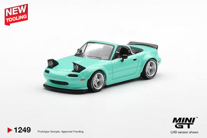 Mini GT Mazda MX-5 (NA) Pandem mint green 1:64 scale diecast model car, front three-quarter view showing the raised pop-up headlights and front splitter