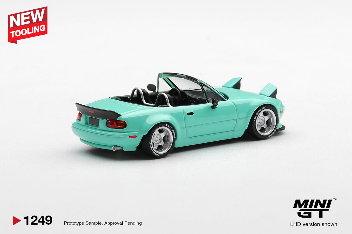 Mini GT Mazda MX-5 (NA) Pandem mint green 1:64 scale diecast model car, rear three-quarter view showing the ducktail spoiler and roll hoops