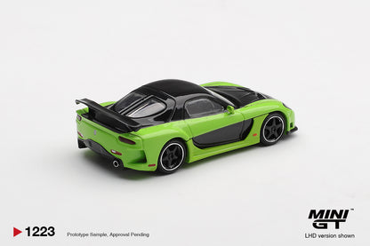 Rear three-quarter view of Mazda RX-7 VeilSide Fortune7 green 1:64 diecast by Mini GT showing the wide rear arches and large rear wing (MGT01223)