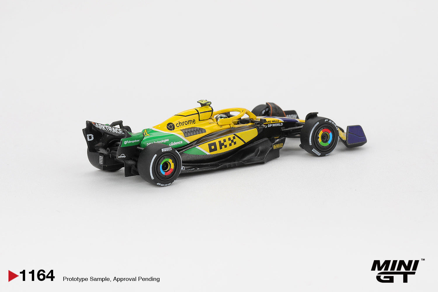 Front three-quarter view of McLaren MCL38 #4 Lando Norris 2024 Monaco GP 1:64 diecast model car by Mini GT in the yellow and green Senna tribute livery (MGT01164)