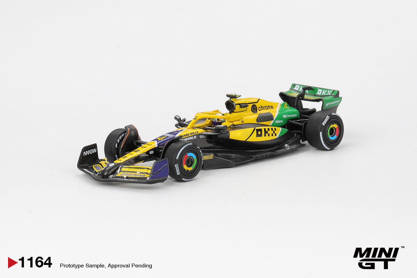 Rear three-quarter view of McLaren MCL38 Norris 2024 Monaco GP 1:64 diecast by Mini GT showing the rear wing and OKX branding (MGT01164)