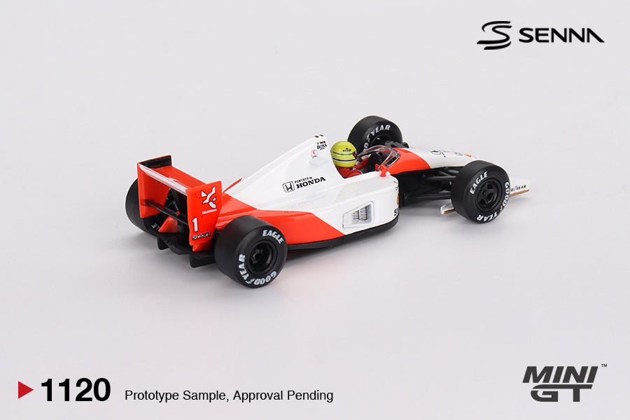 Mini GT McLaren MP4/6 #1 Ayrton Senna 1991 1:64 scale diecast model car, rear three-quarter view showing the red rear wing with #1