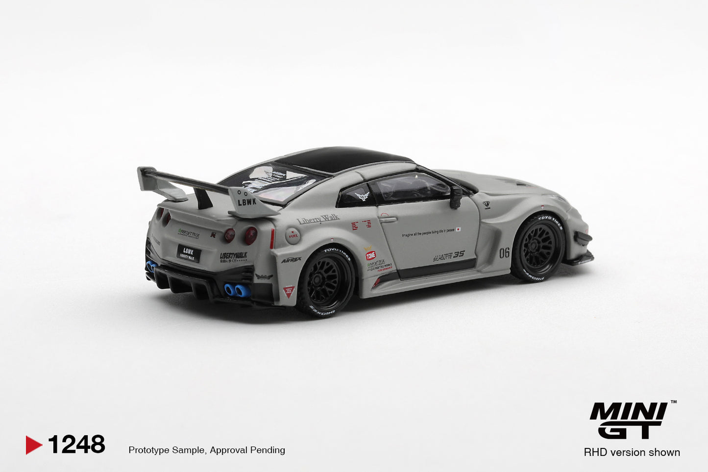 Rear three-quarter view of Nissan 35GT-RR Ver.1 matt grey 1:64 diecast by Mini GT showing the swan-neck rear wing and quad tail lights (MGT01248)