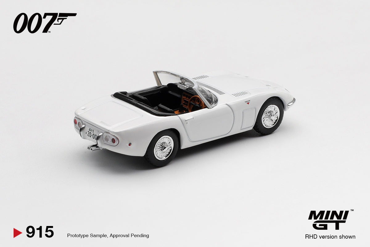 Mini GT Toyota 2000GT Roadster You Only Live Twice 007 white 1:64 scale diecast model car, rear three-quarter view showing the open cockpit and period Japanese licence plate