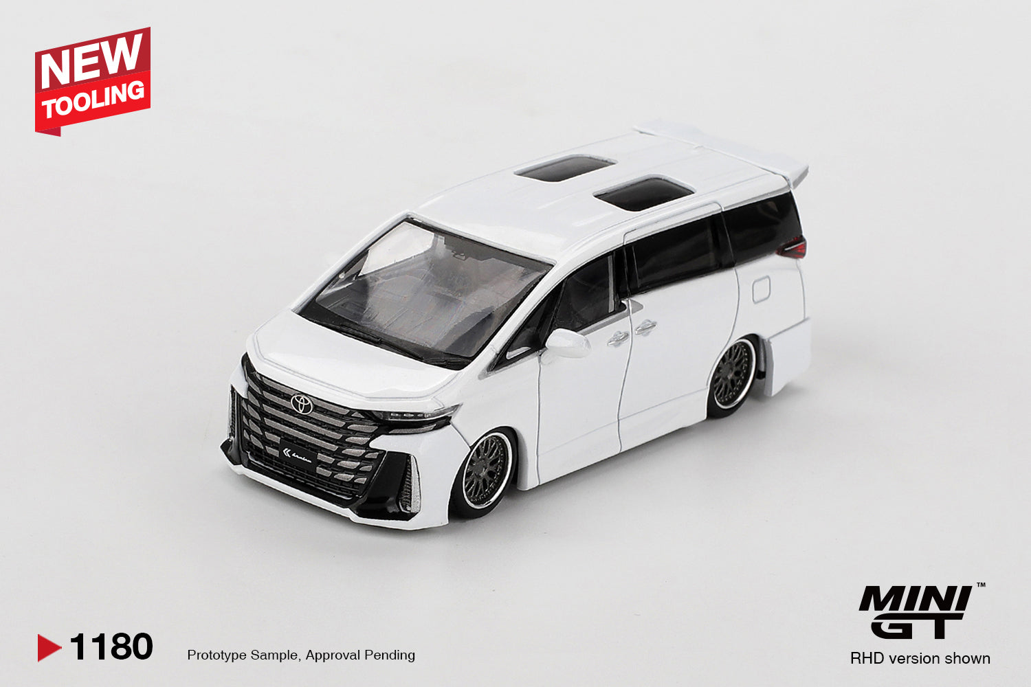 Front three-quarter view of Toyota Vellfire 40 KUHL White 1:64 diecast model car by Mini GT showing the KUHL front bumper and mesh grille (MGT01180)