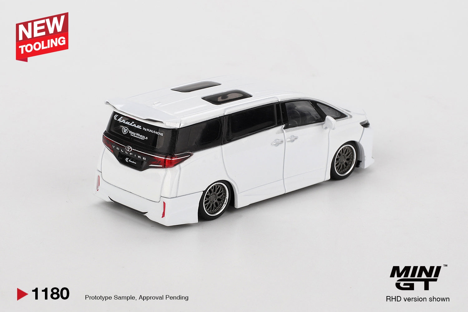 Rear three-quarter view of Toyota Vellfire 40 KUHL White 1:64 diecast showing the roof spoiler and full-width tail lights (MGT01180)