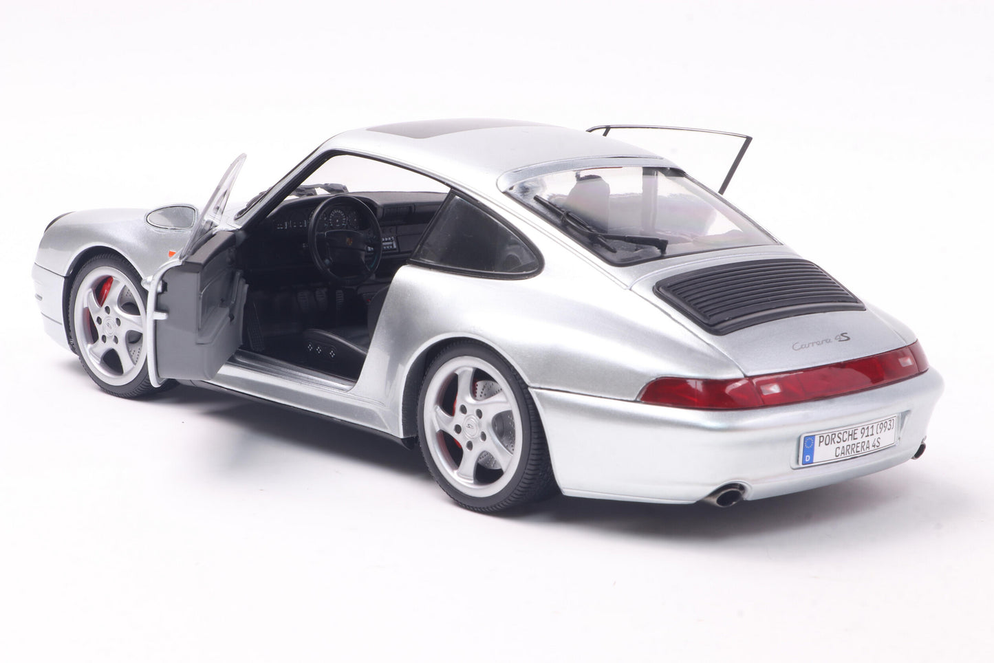 Back perspective view with door open Porsche 911 (993) 4S Polar Silver 1996 1:18 scale model car - Solido