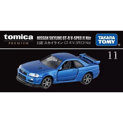 Blue toy car model of Nissan Skyline GT-R V-Spec II Nür by Takara Tomy on a white background