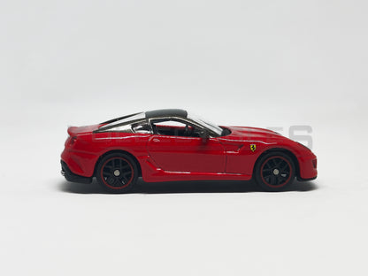 side view of Ferrari 599 GTO Red 1:64 scale model car - Bburago