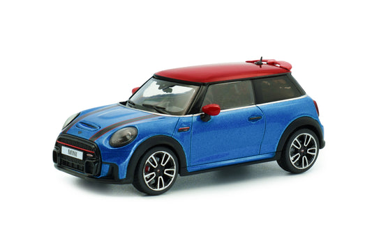Front three-quarter view of Mini Cooper John Cooper Works Island Blue Metallic 2023 1:43 diecast model car by Solido with Chili Red roof and black bonnet stripes (S4315003)