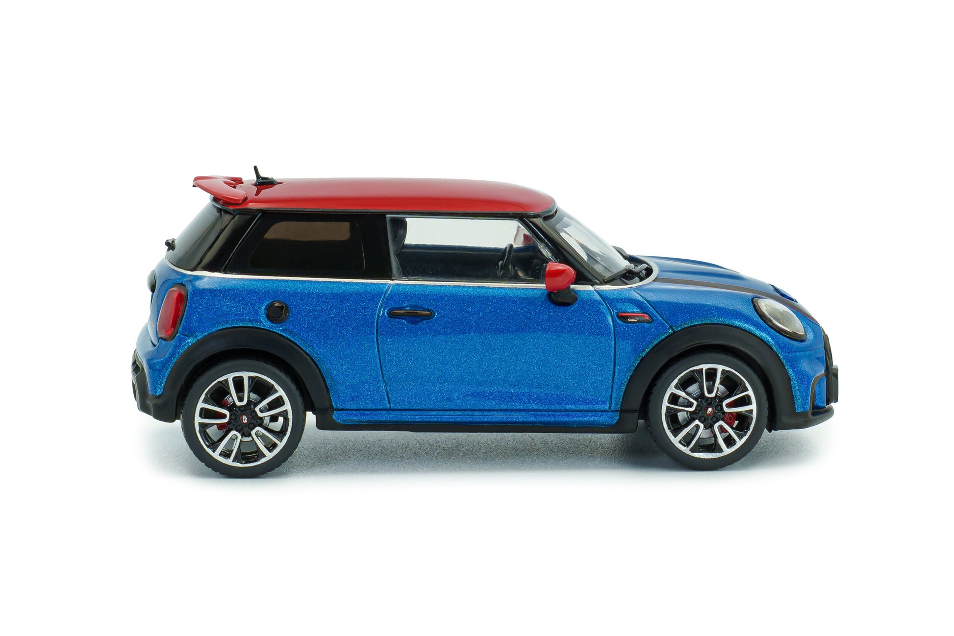 Side profile of Mini Cooper John Cooper Works Island Blue Metallic 2023 1:43 scale model car by Solido with machined multi-spoke JCW alloys (S4315003)