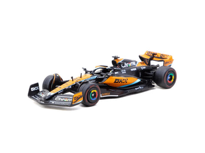 Front three-quarter view of McLaren MCL60 Oscar Piastri number 81 1:64 diecast F1 model by Tarmac Works in papaya and Chrome livery (T64G-F070-OP2)