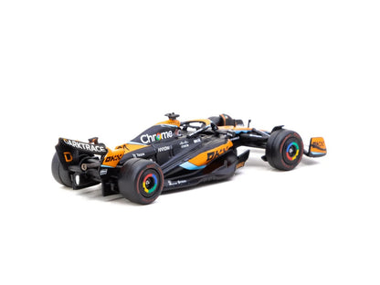 Rear three-quarter view of McLaren MCL60 1:64 diecast showing the rear wing, diffuser and Pirelli soft tyres (T64G-F070-OP2)