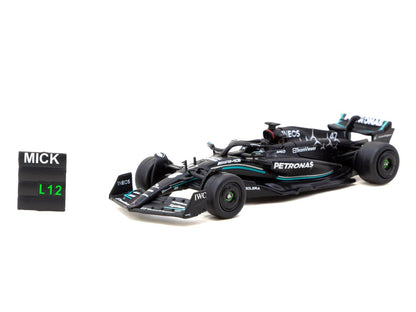 Front three-quarter view of Mercedes-AMG F1 W14 Mick Schumacher number 47 1:64 diecast by Tarmac Works with the MICK pit board accessory (T64G-F064-MS1)