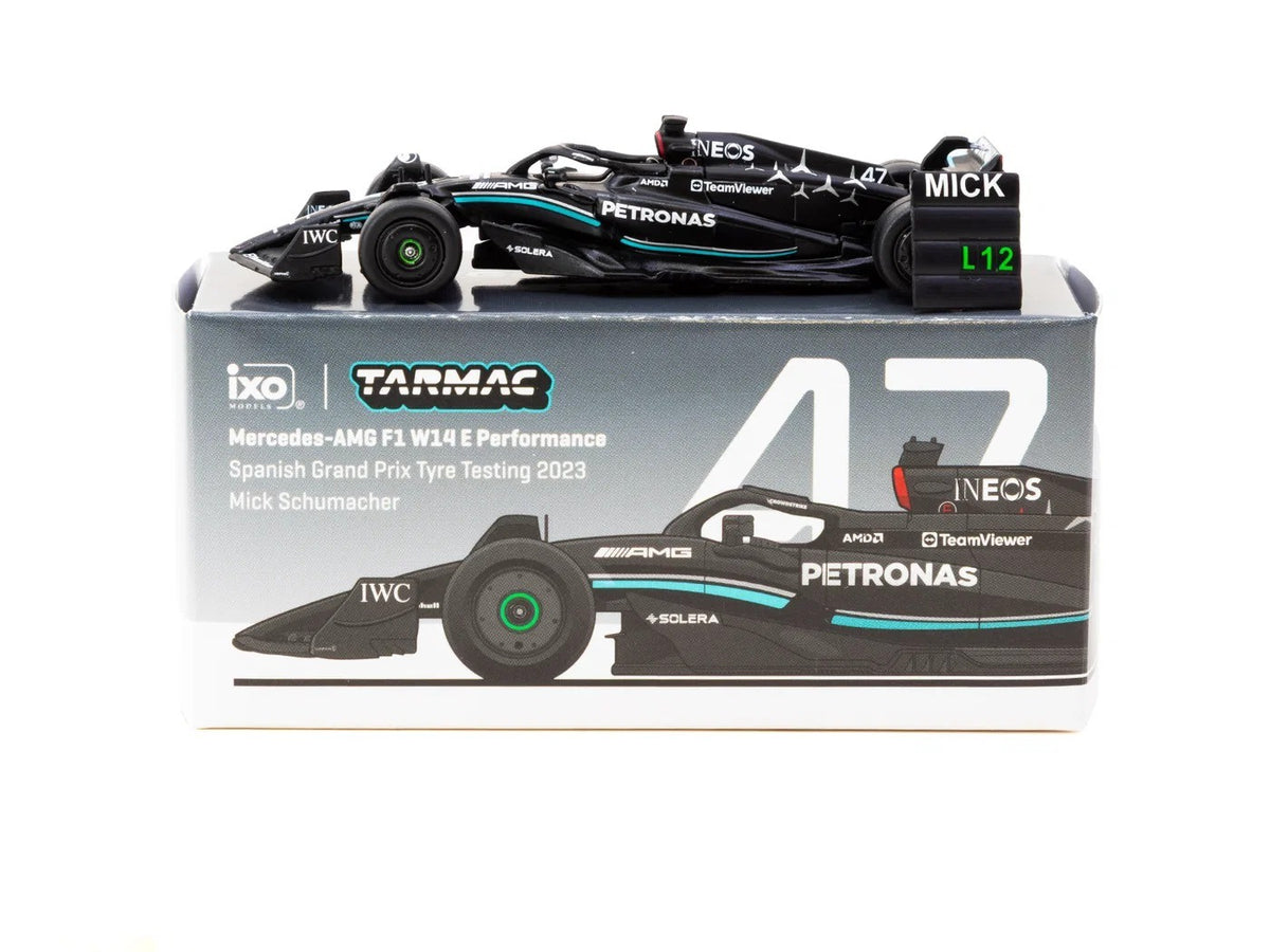Mercedes-AMG F1 W14 Mick Schumacher 1:64 scale model car in its Tarmac Works x iXO Spanish Grand Prix tyre testing display packaging (T64G-F064-MS1)