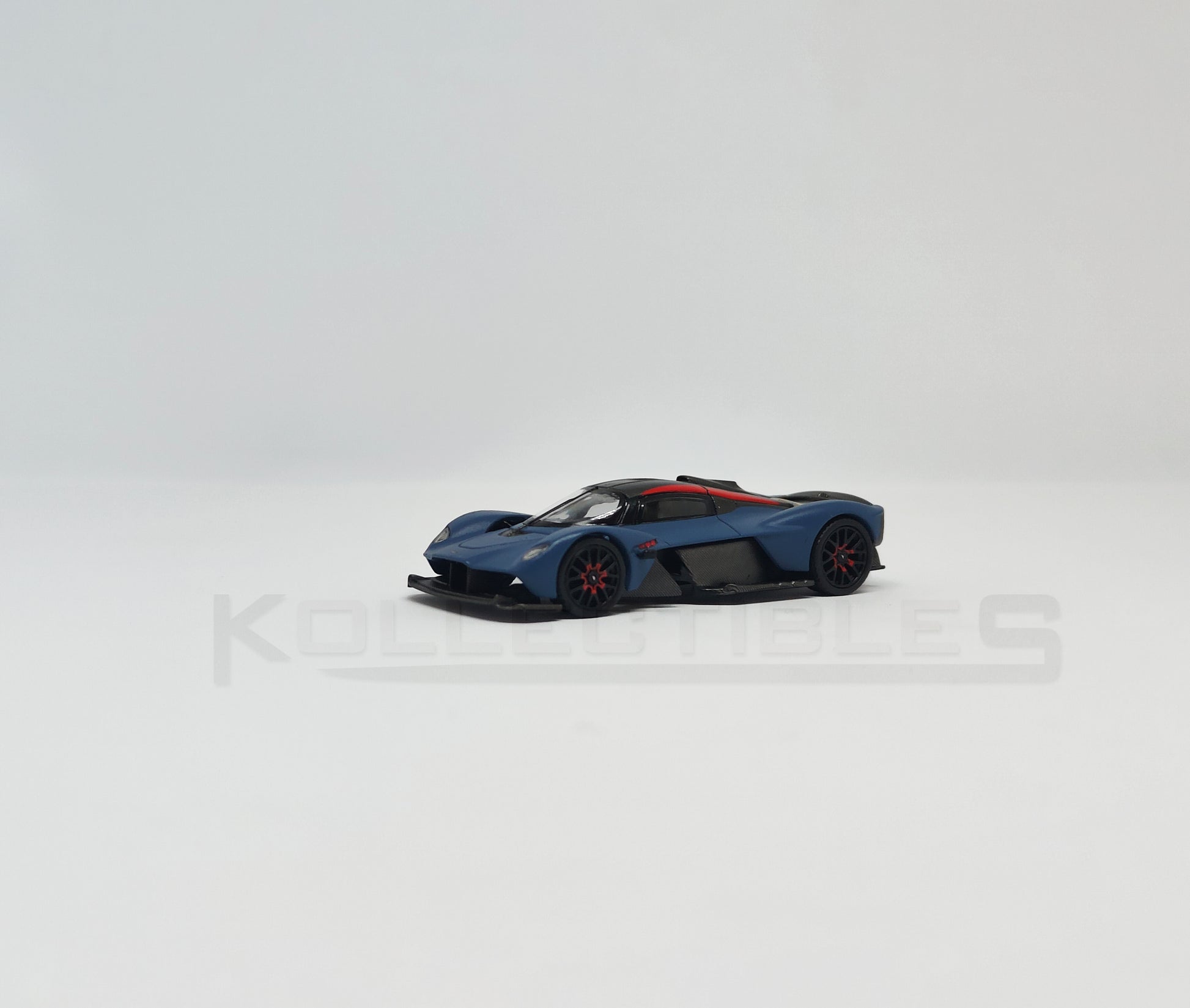 Perspective view of Aston Martin Valkyire Satin Marina Blue 1:64 scale model car- Xcartoys x Poprace